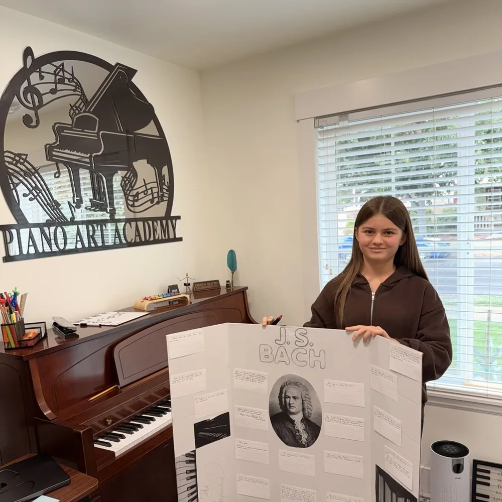 A student presenting her project about Bach at the academy