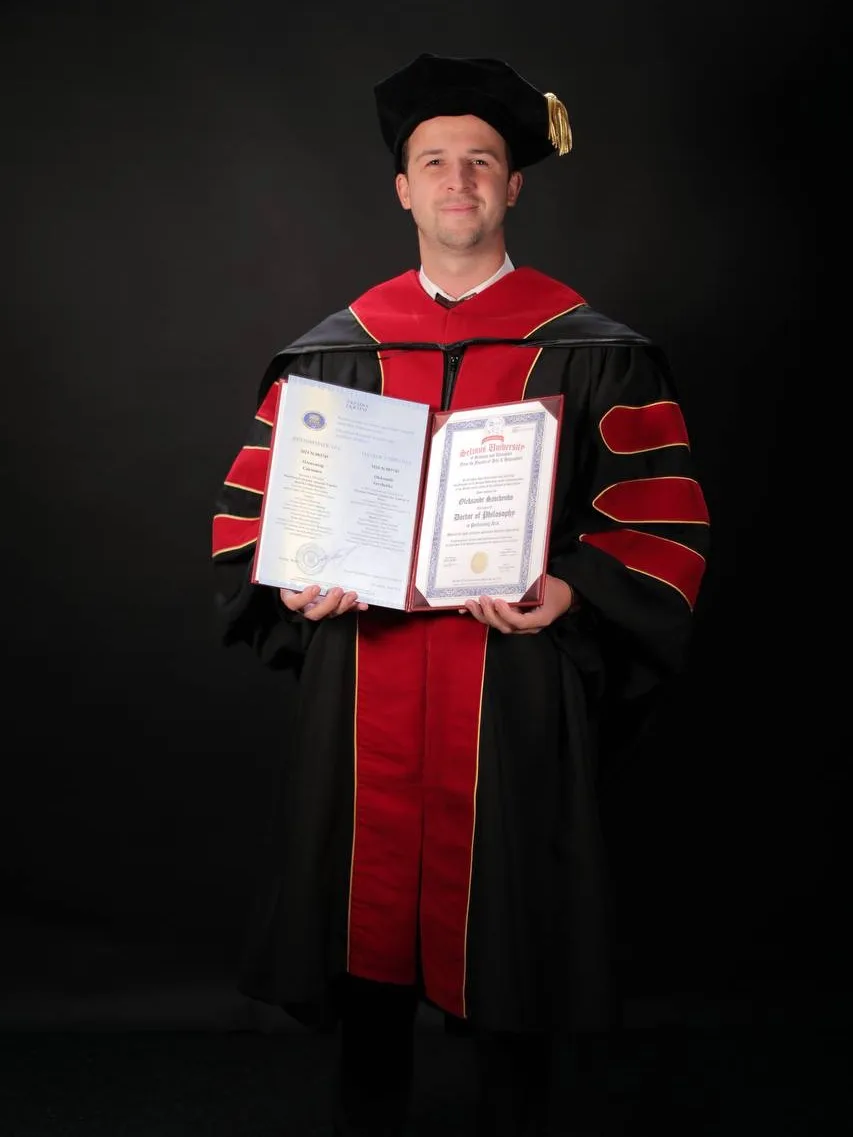 Aleksandr Savchenko with his doctoral diploma in music